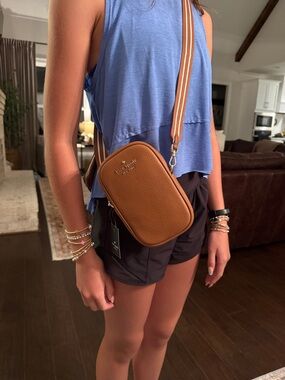 kate spade Pebbled Leather Crossbody in Cognac with Striped Strap